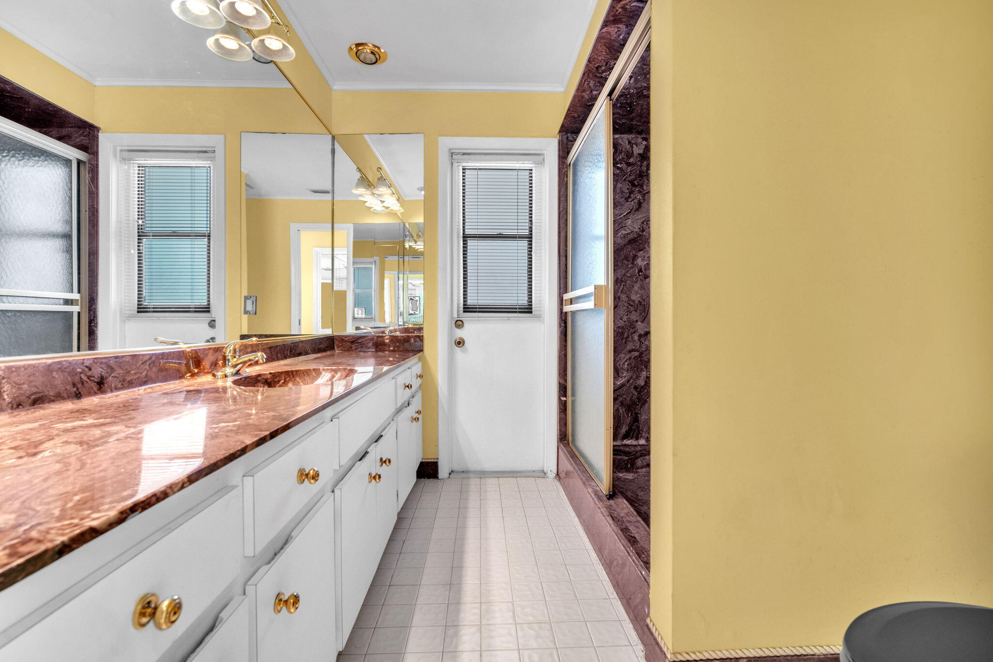 6794 Giralda Circle Boca Raton, FL 33433 - Photo 19 of 49 a spacious bathroom with a granite countertop sink and a mirror
