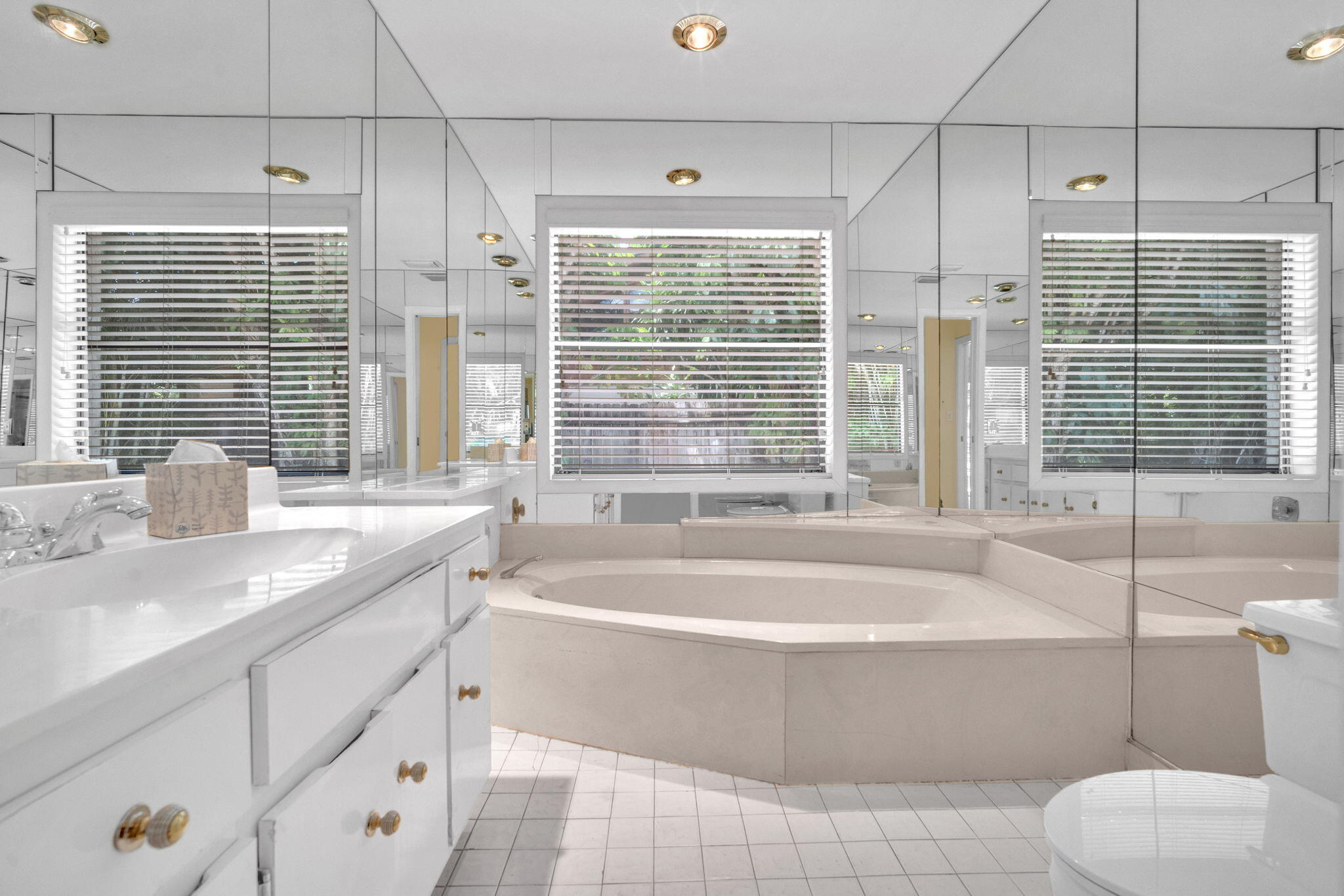 6794 Giralda Circle Boca Raton, FL 33433 - Photo 21 of 49 a bathroom with a granite countertop bathtub and a sink