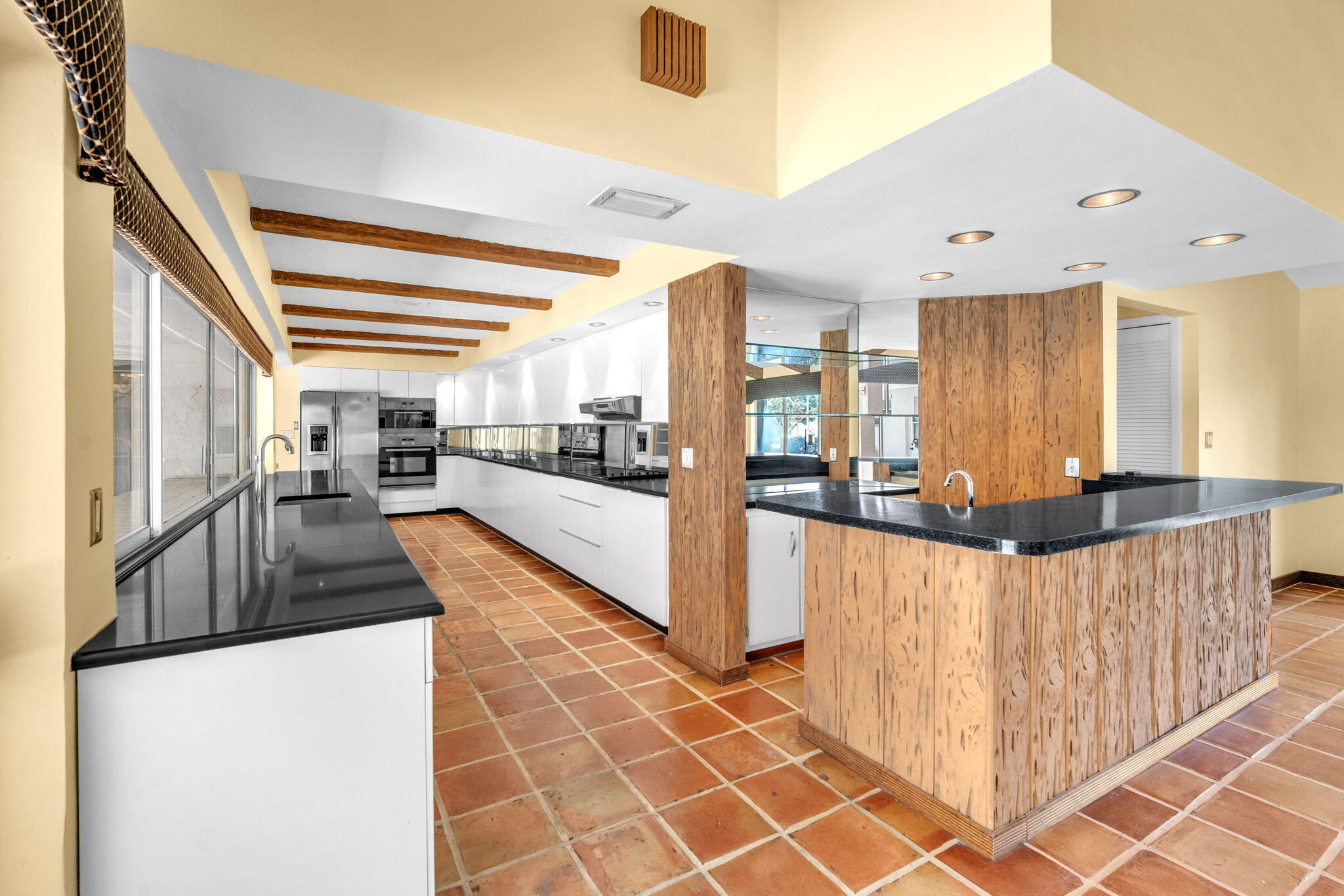 6794 Giralda Circle Boca Raton, FL 33433 - Photo 30 of 49 a view of a kitchen with kitchen island granite countertop a refrigerator and a stove top oven