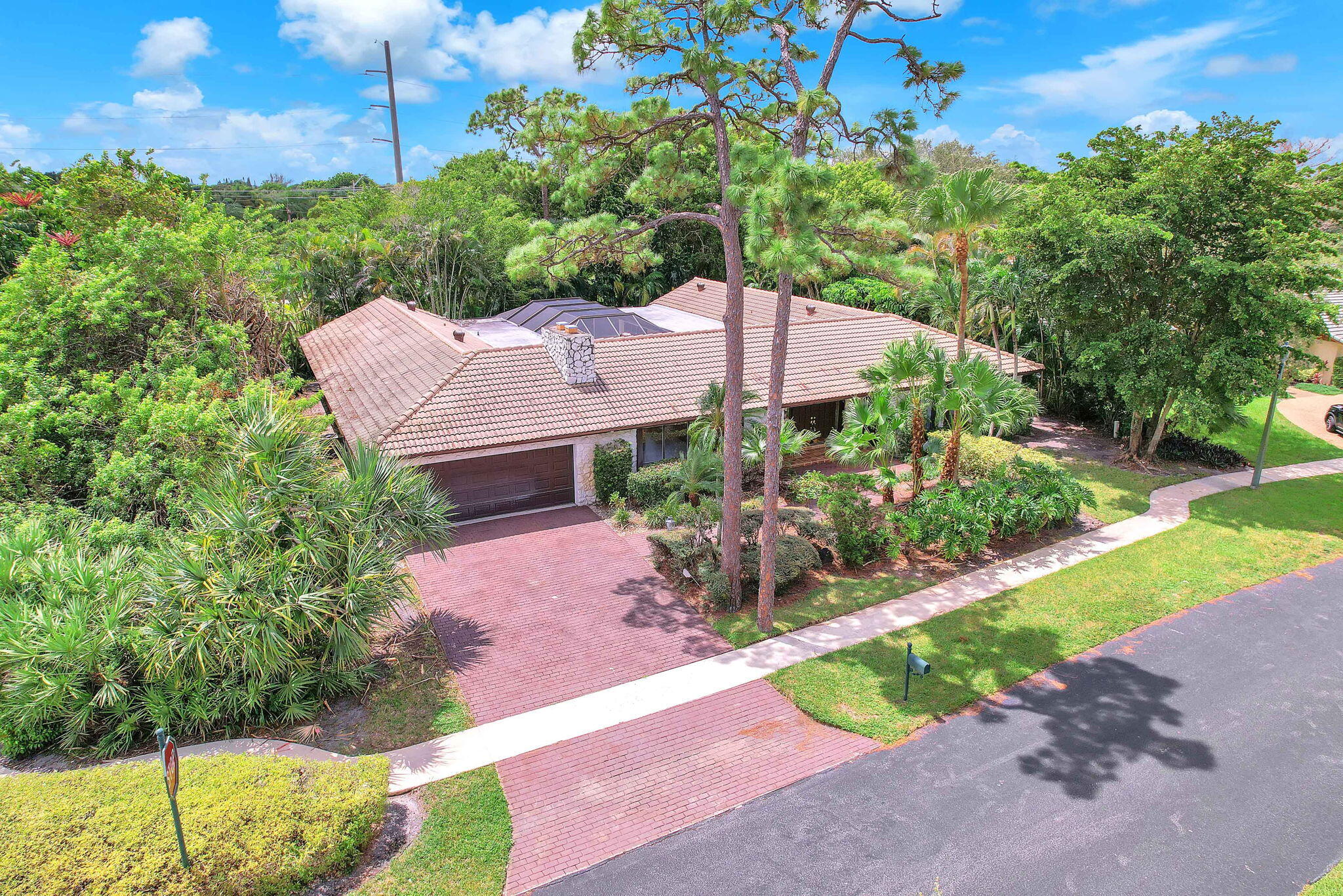 6794 Giralda Circle Boca Raton, FL 33433 - Photo 3 of 49 a view of a house with a small yard and a large tree