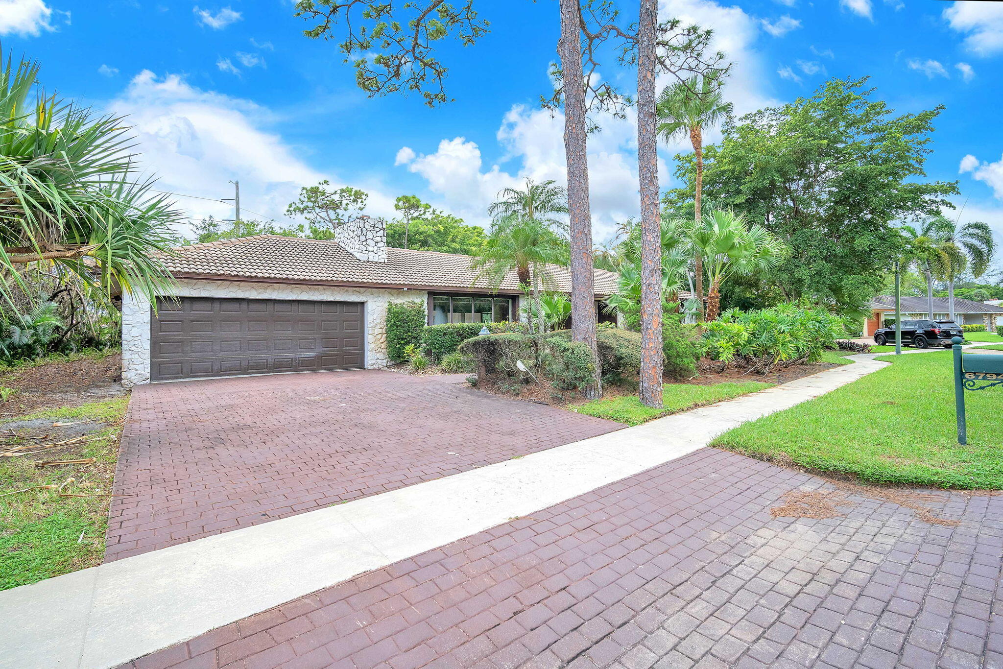 6794 Giralda Circle Boca Raton, FL 33433 - Photo 6 of 49 a front view of a house with garden