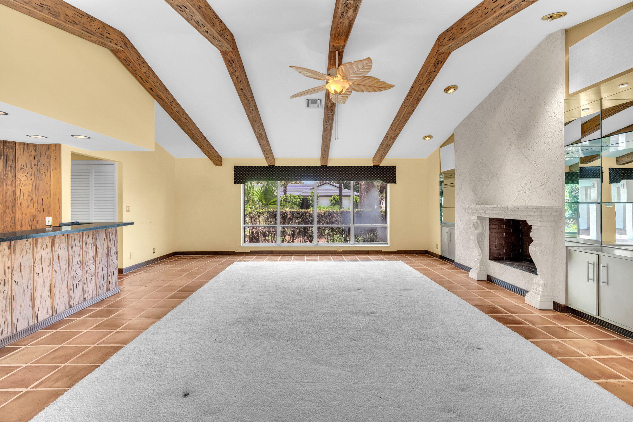 6794 Giralda Circle Boca Raton, FL 33433 - Photo 8 of 49 a view of an empty room with a fireplace and a window