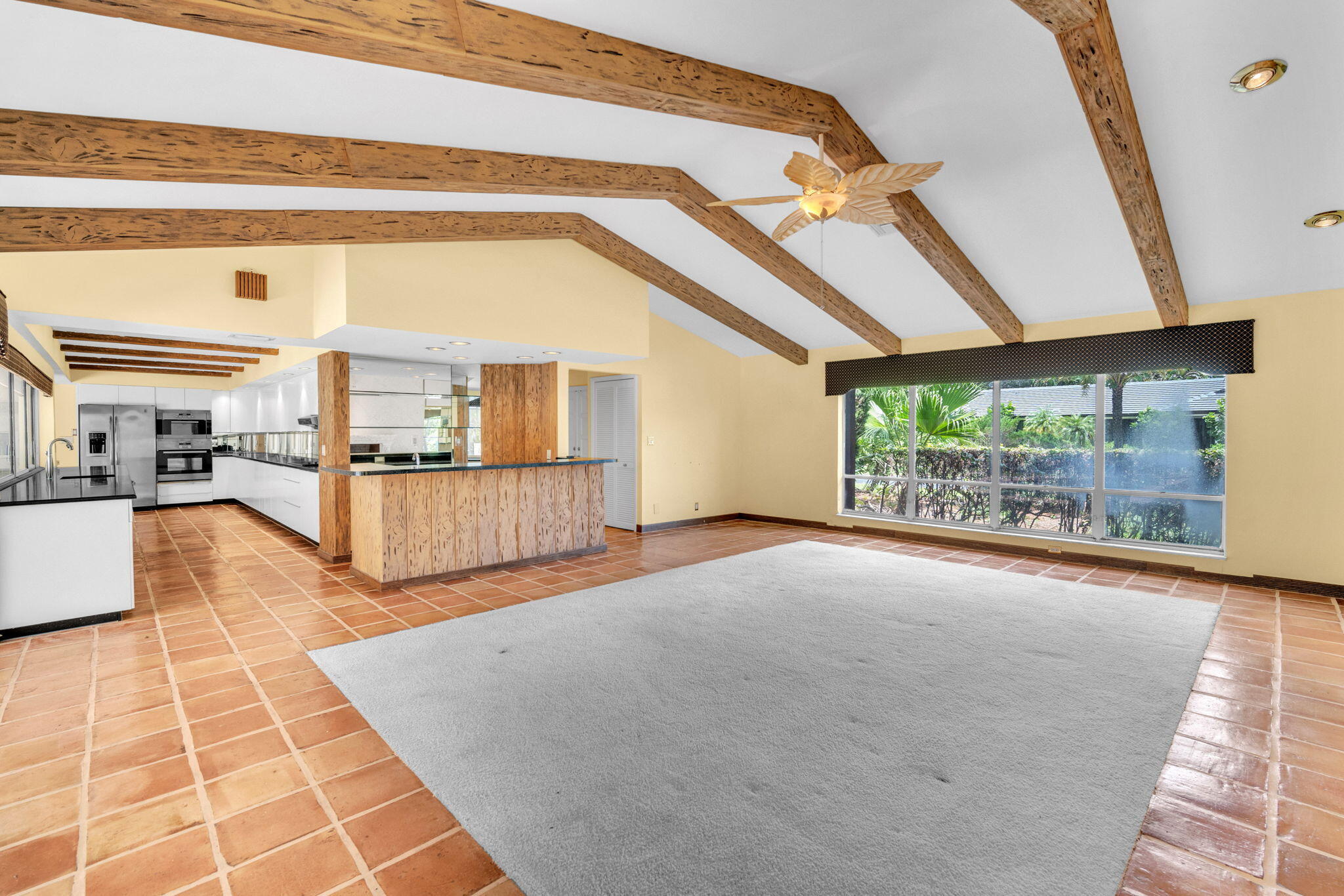 6794 Giralda Circle Boca Raton, FL 33433 - Photo 9 of 49 a view of an empty room with wooden floor and a fireplace