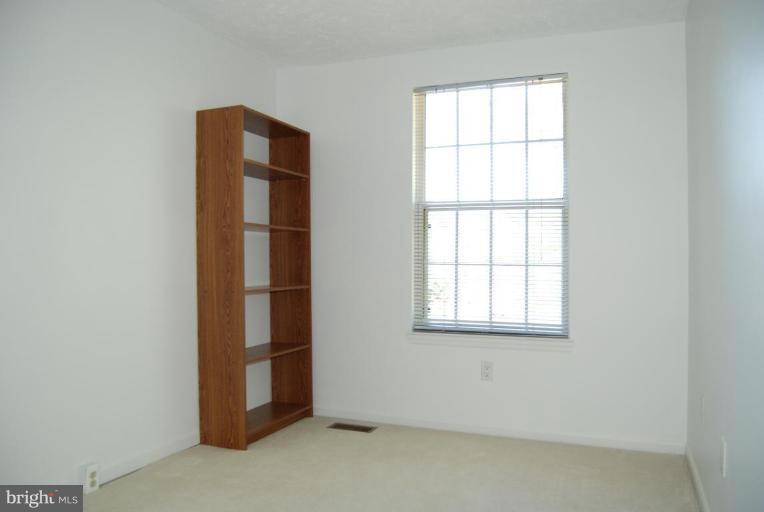 1488 Autumn Ridge Circle Reston, VA 20194 - Photo 4 of 30 an empty room with windows