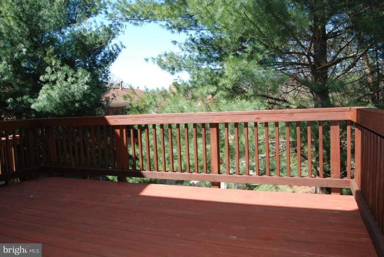 1488 Autumn Ridge Circle Reston, VA 20194 - Photo 5 of 30 a view of deck with wooden floor and fence
