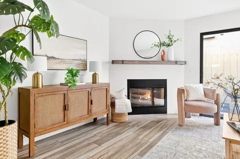 a view of kitchen with furniture and a fireplace