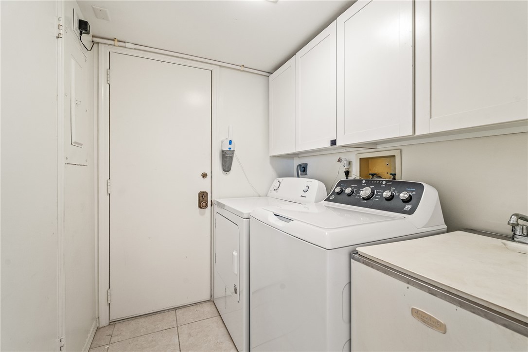 1850 Bay Road, Unit 3F Vero Beach, FL 32963 - Photo 26 of 34 a utility room with dryer and washer