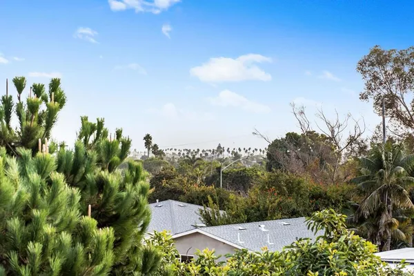 an aerial view of multiple houses with yard