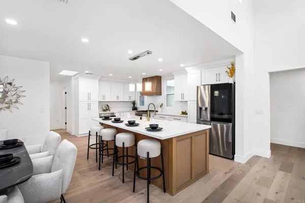 a kitchen with a sink stainless steel appliances and cabinets