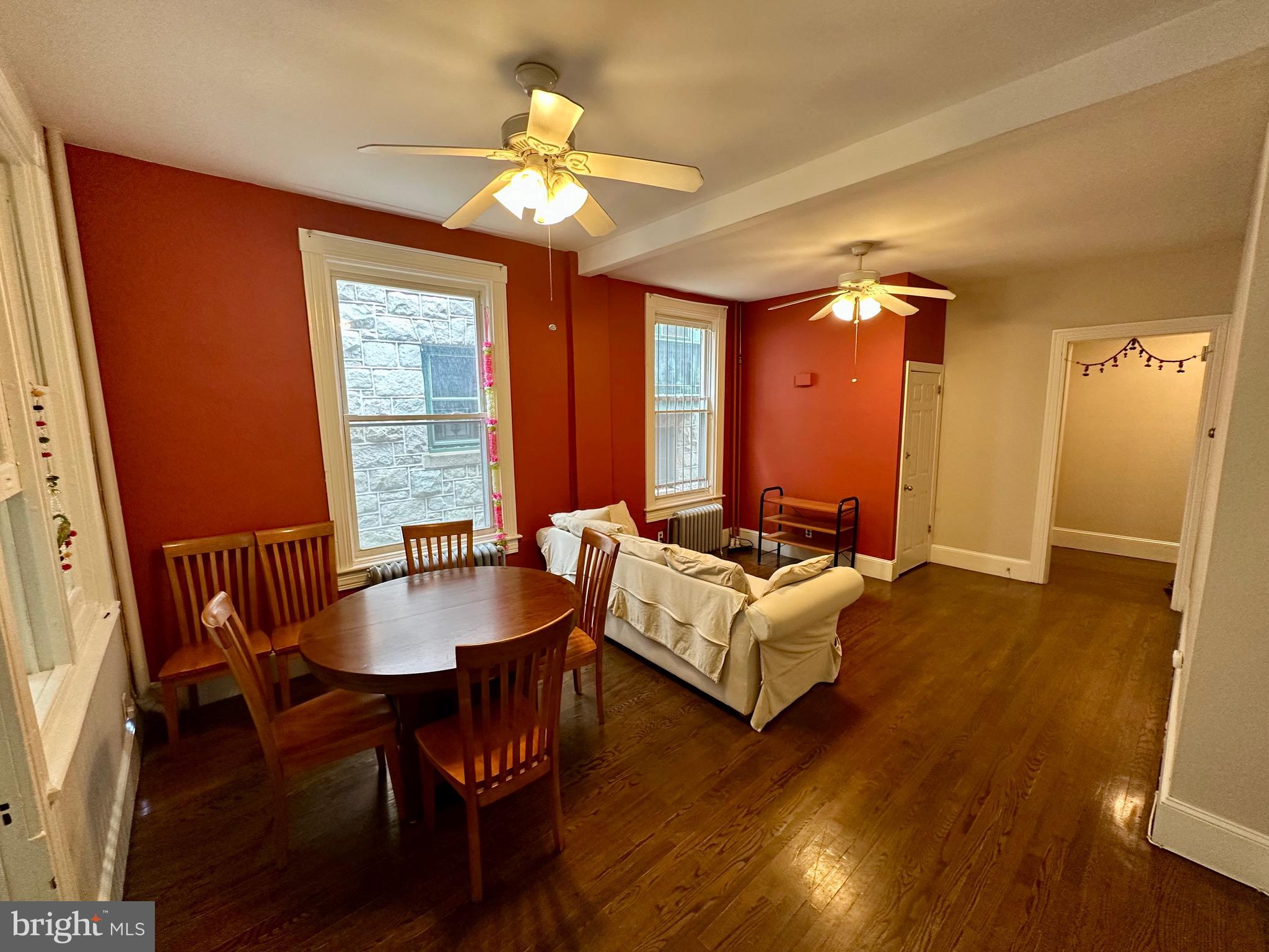 4805 Springfield Avenue Philadelphia, PA 19143 - Photo 15 of 22 a view of a a dining room with furniture window and wooden floor