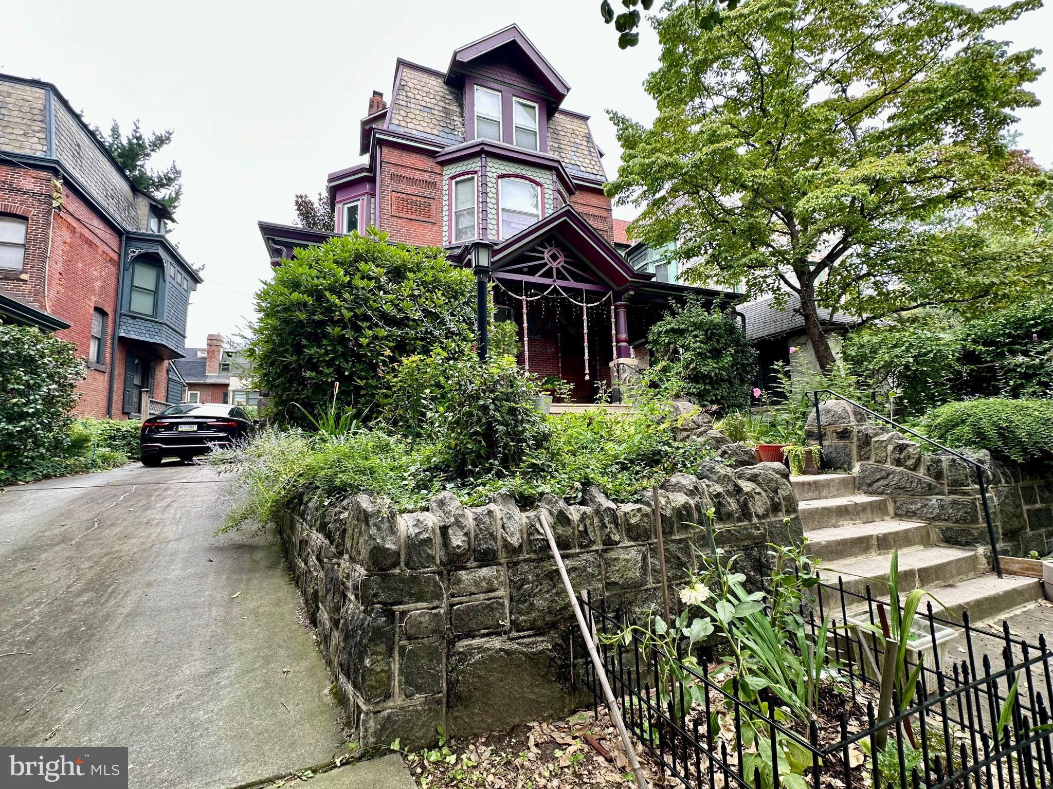 4805 Springfield Avenue Philadelphia, PA 19143 - Photo 2 of 22 a view of a house with a small yard and plants