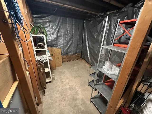 a view of walk in closet with clothes