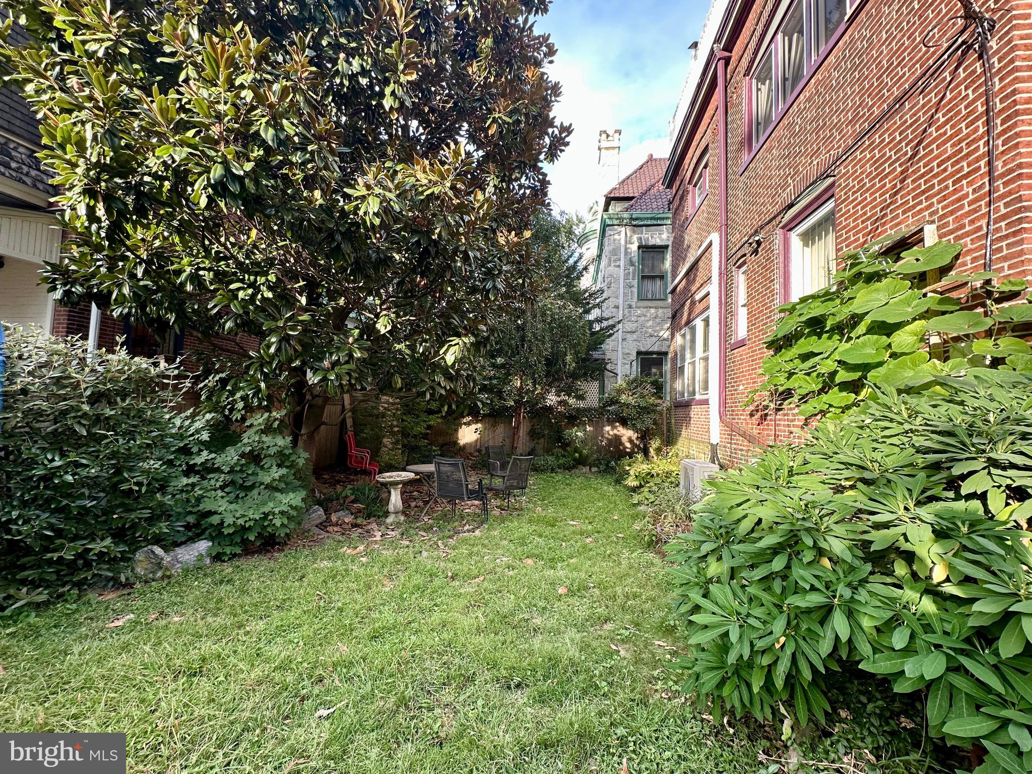 4805 Springfield Avenue Philadelphia, PA 19143 - Photo 22 of 22 a backyard of a house with table and chairs