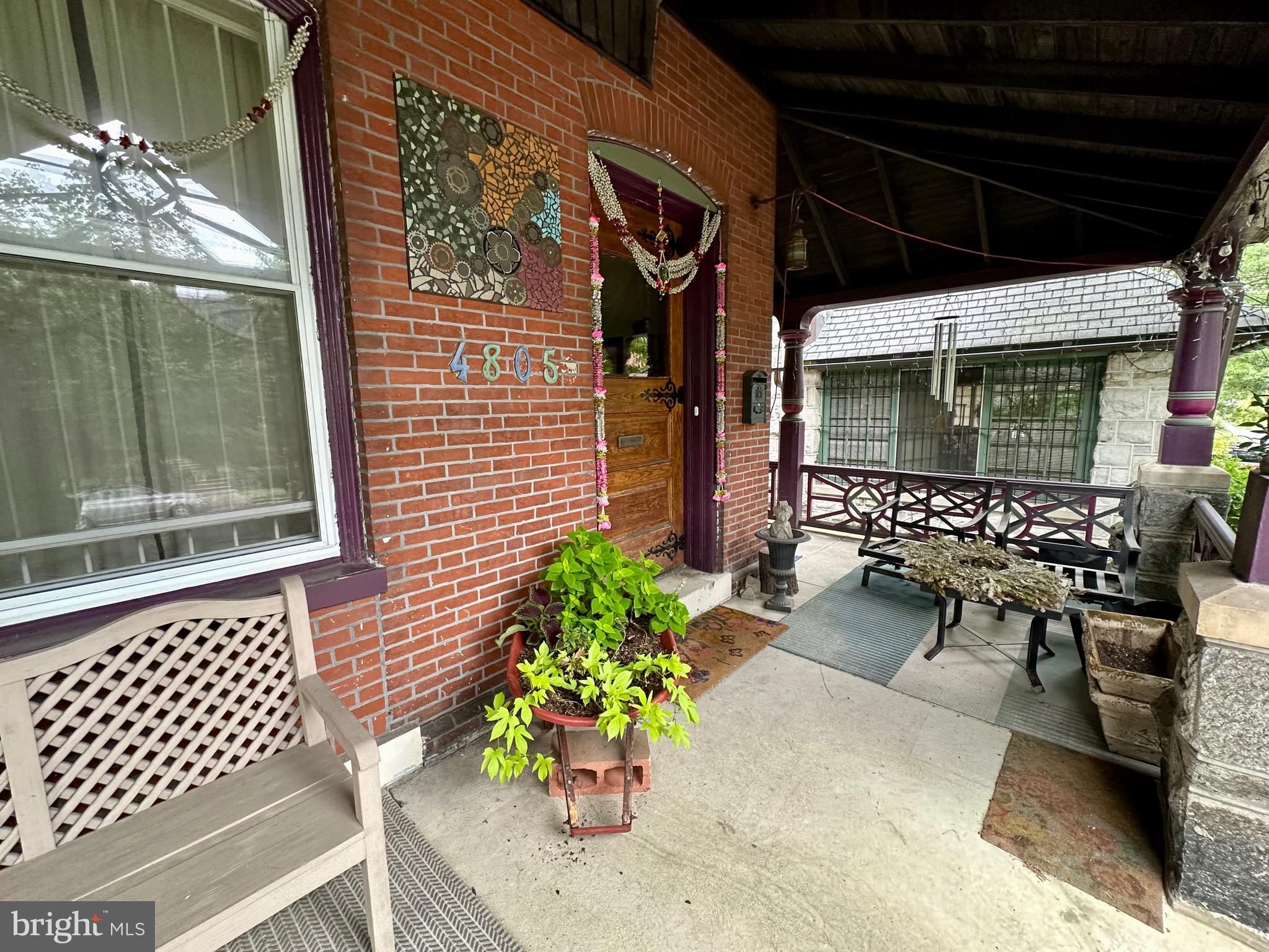 4805 Springfield Avenue Philadelphia, PA 19143 - Photo 3 of 22 a view of a chairs and table in a patio