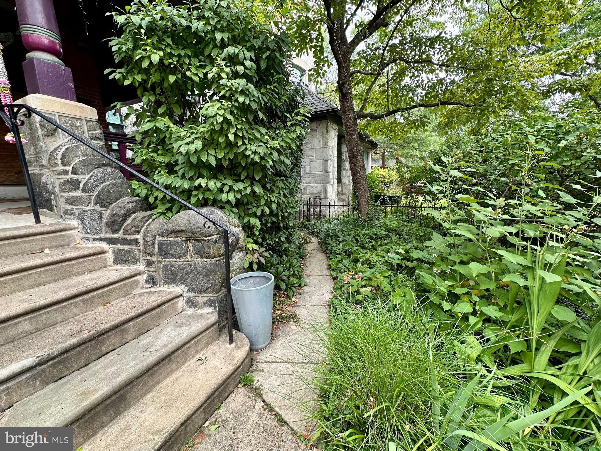 4805 Springfield Avenue Philadelphia, PA 19143 - Photo 4 of 22 a view of a backyard with plants and a garden