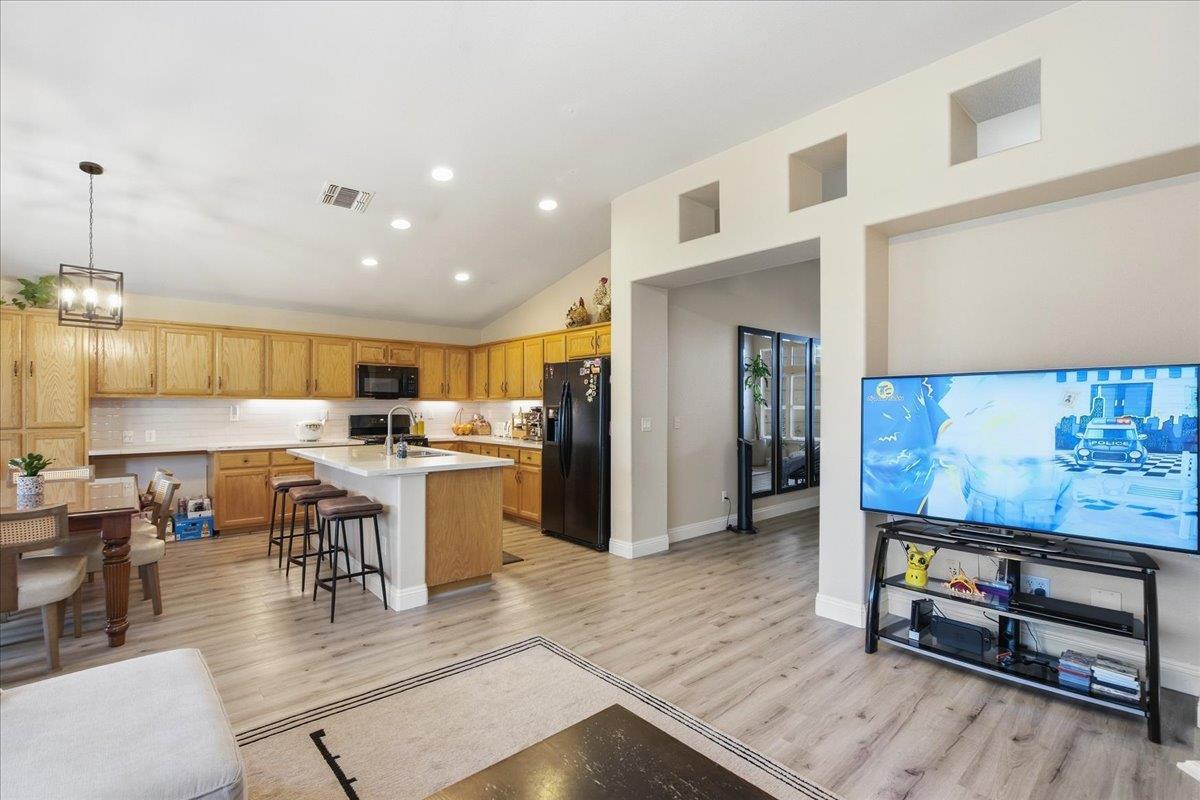 7821 Shell Beach Drive Antelope, CA 95843 - Photo 11 of 40 a kitchen with a table and chairs in it