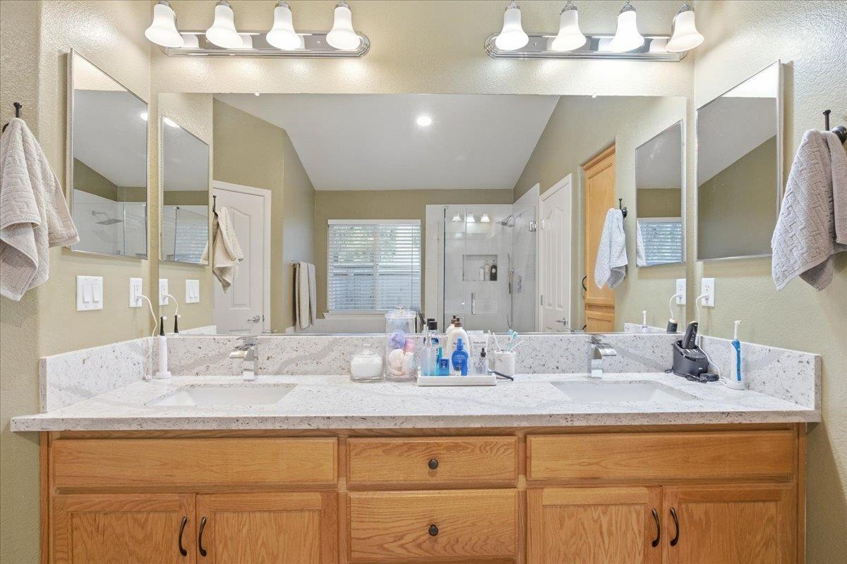 7821 Shell Beach Drive Antelope, CA 95843 - Photo 26 of 40 a bathroom with a sink double vanity and a mirror