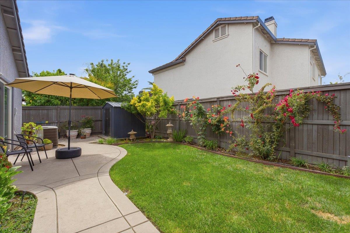 7821 Shell Beach Drive Antelope, CA 95843 - Photo 35 of 40 a view of a chair and table in the backyard
