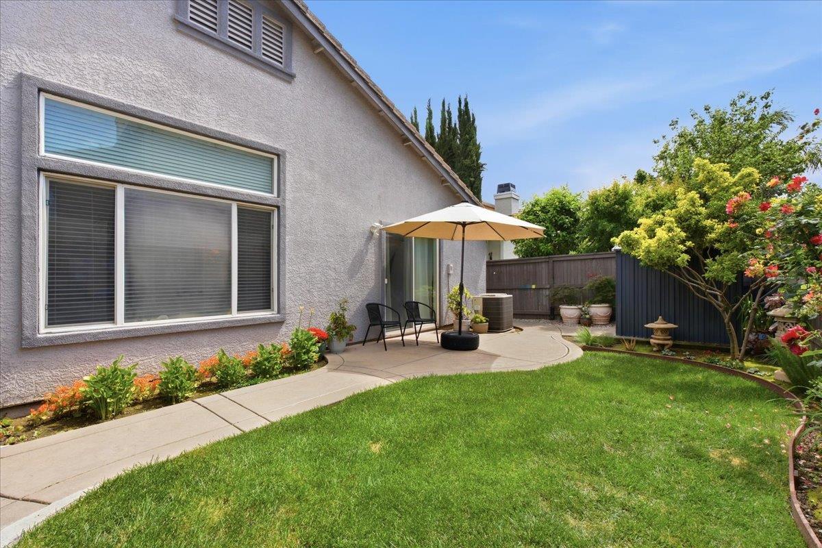 7821 Shell Beach Drive Antelope, CA 95843 - Photo 36 of 40 a front view of a house with patio and garden