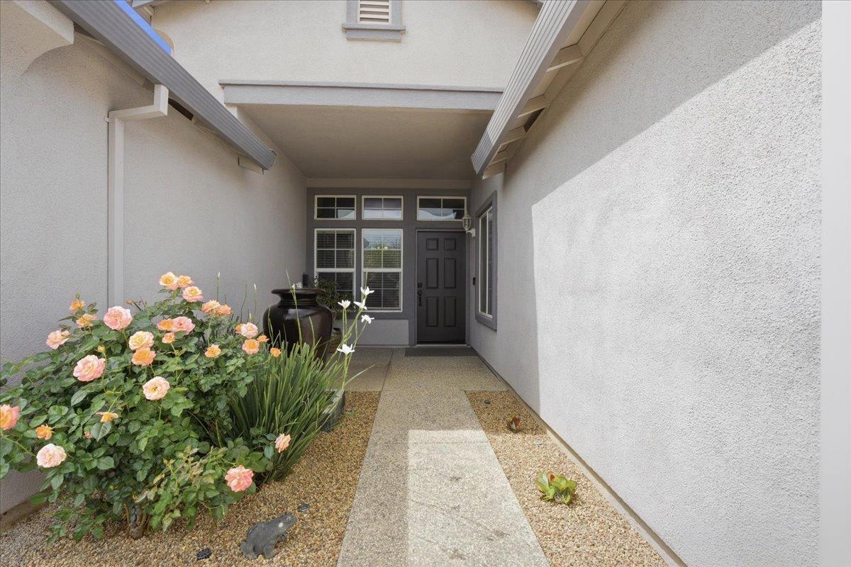 7821 Shell Beach Drive Antelope, CA 95843 - Photo 4 of 40 a hallway with beautiful flowers