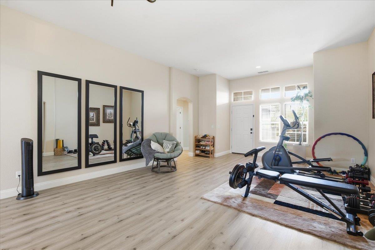 7821 Shell Beach Drive Antelope, CA 95843 - Photo 7 of 40 a living room with furniture a rug and a large window