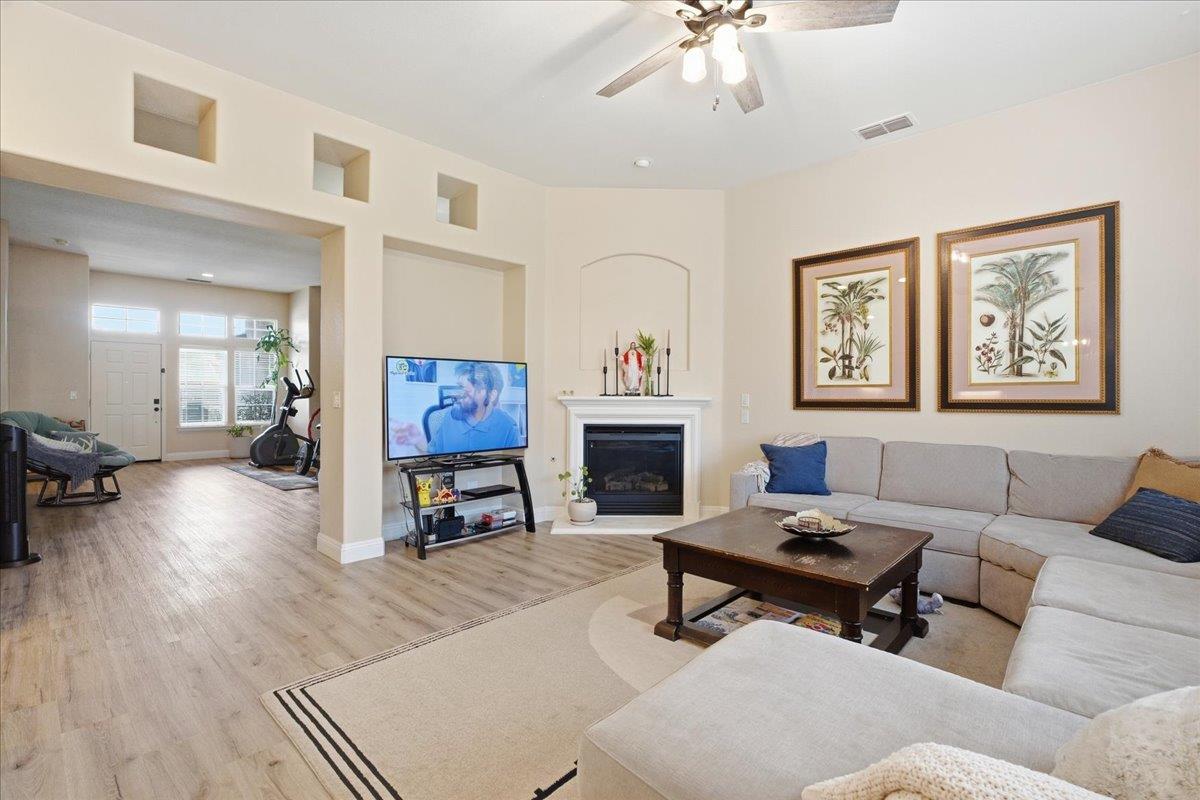 7821 Shell Beach Drive Antelope, CA 95843 - Photo 9 of 40 a living room with furniture and a fireplace