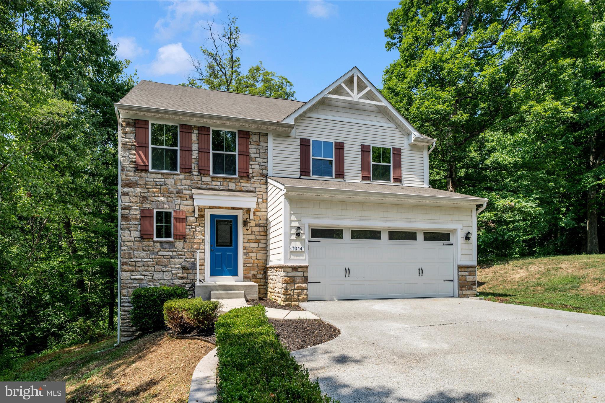 7014 Linden Avenue Elkridge, MD 21075 - Photo 3 of 42 a front view of a house with a yard and garage