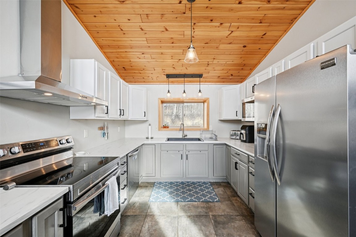 1499 Sheep Ridge Road Fairplay, CO 80440 - Photo 14 of 40 a kitchen with stainless steel appliances granite countertop a sink a stove and cabinets