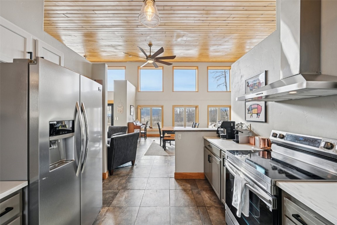 1499 Sheep Ridge Road Fairplay, CO 80440 - Photo 15 of 40 a kitchen with cabinets and stainless steel appliances