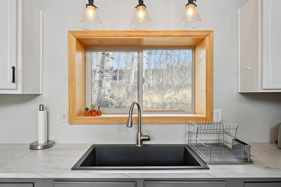 1499 Sheep Ridge Road Fairplay, CO 80440 - Photo 17 of 40 a kitchen with a sink and a window