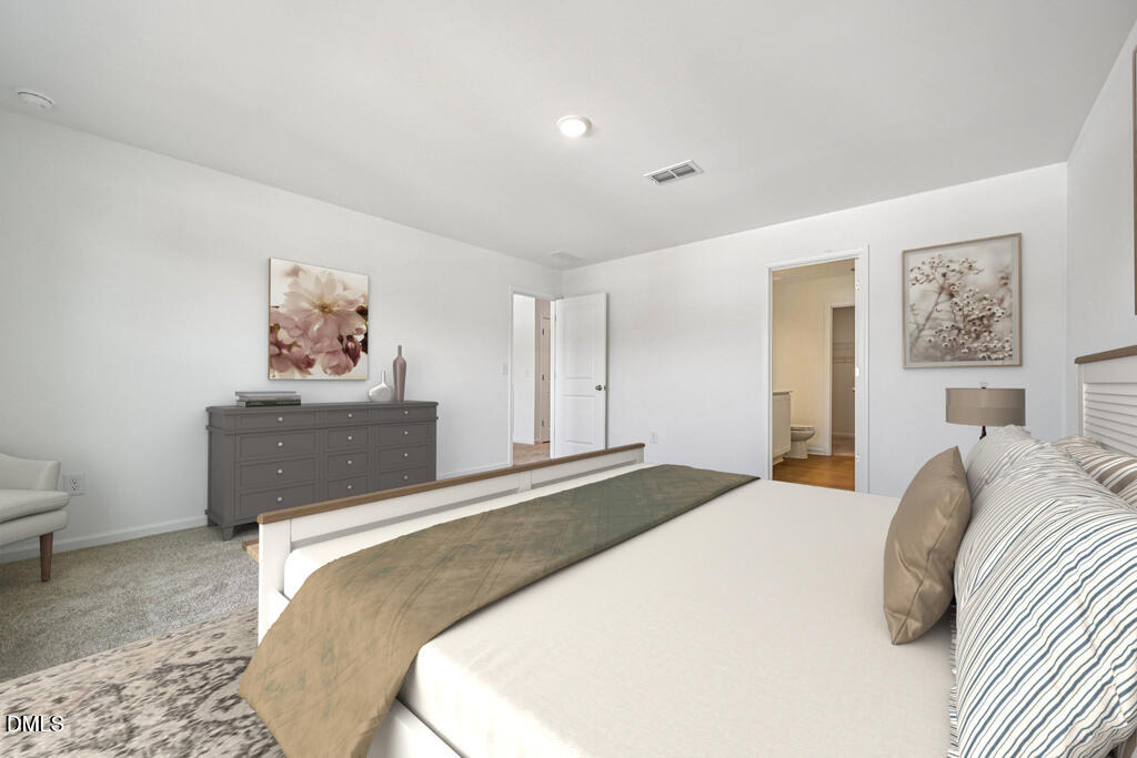 11287 Salers Loop Middlesex, NC 27557 - Photo 16 of 23 a bedroom with a bed and a painting on the wall