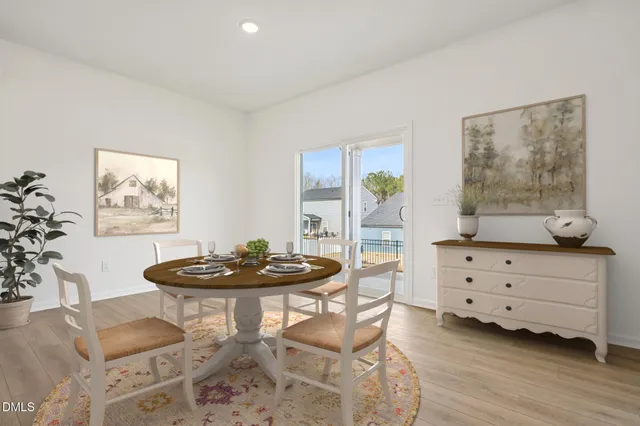 a kitchen with sink a microwave and cabinets