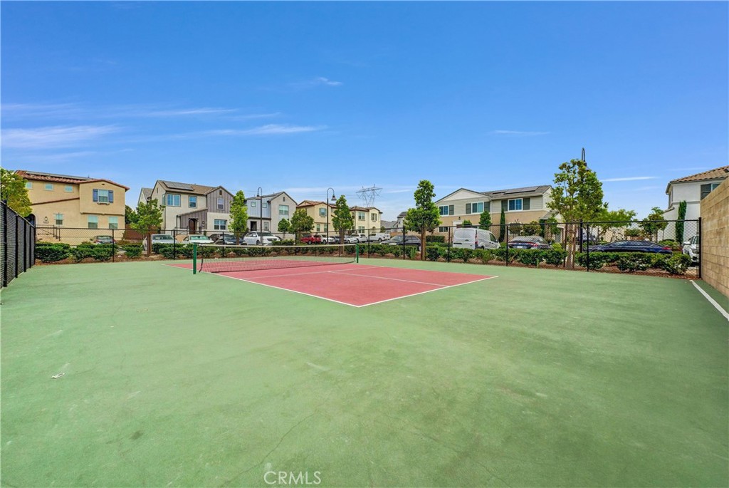 5584 Kate Way, Unit 10 Fontana, CA 92336 - Photo 30 of 42 a view of green field with house in the background