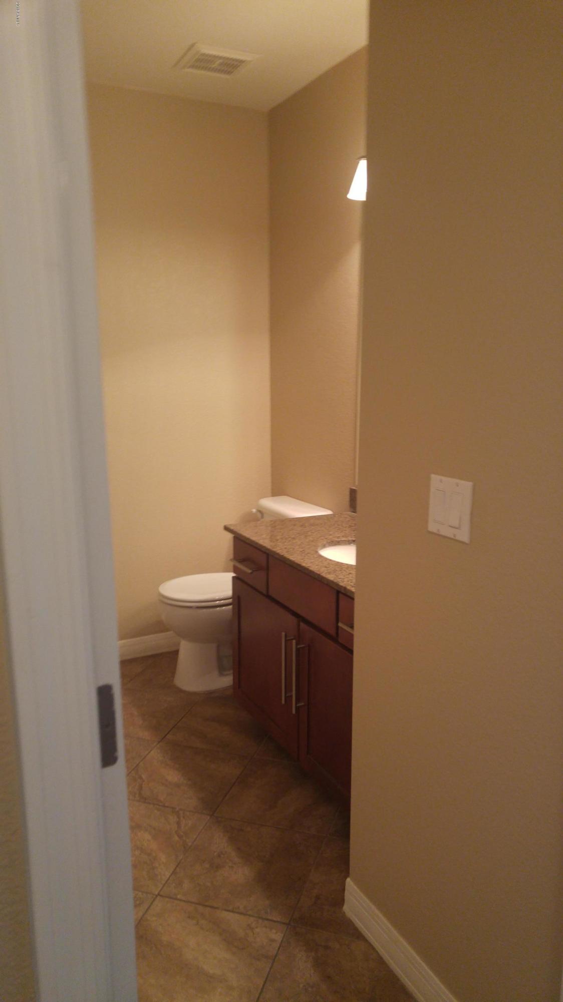 2025 East Campbell Avenue, Unit 341 Phoenix, AZ 85016 - Photo 14 of 20 a bathroom with a sink and a toilet
