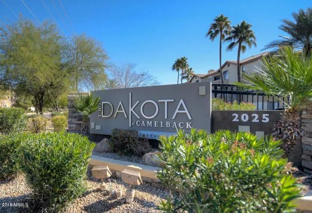 a sign that is sitting in front of a house