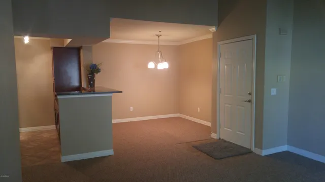 a view of a hallway with two room