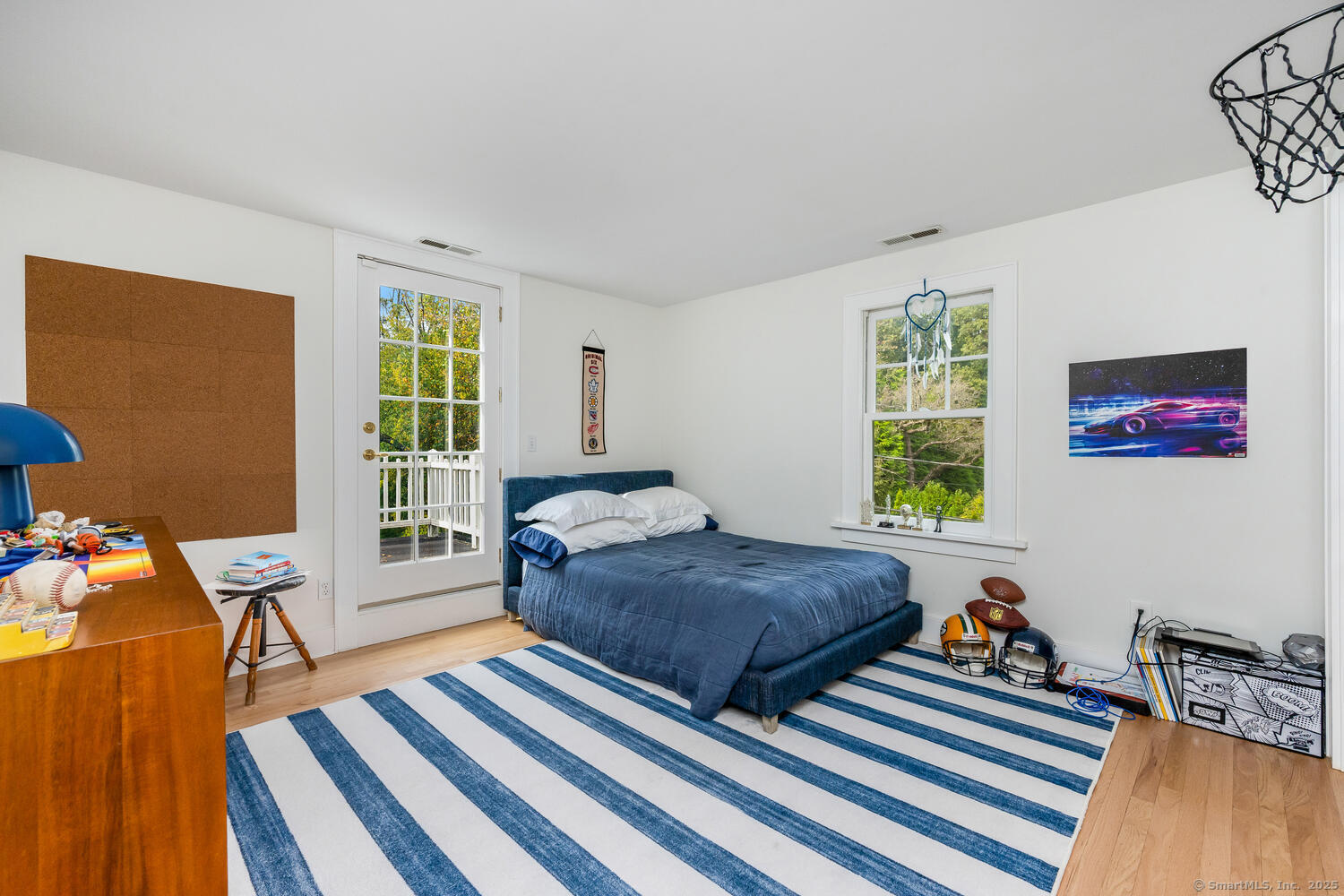 128 5 Mile River Road Darien, CT 06820 - Photo 11 of 23 a bedroom with two beds and a large window