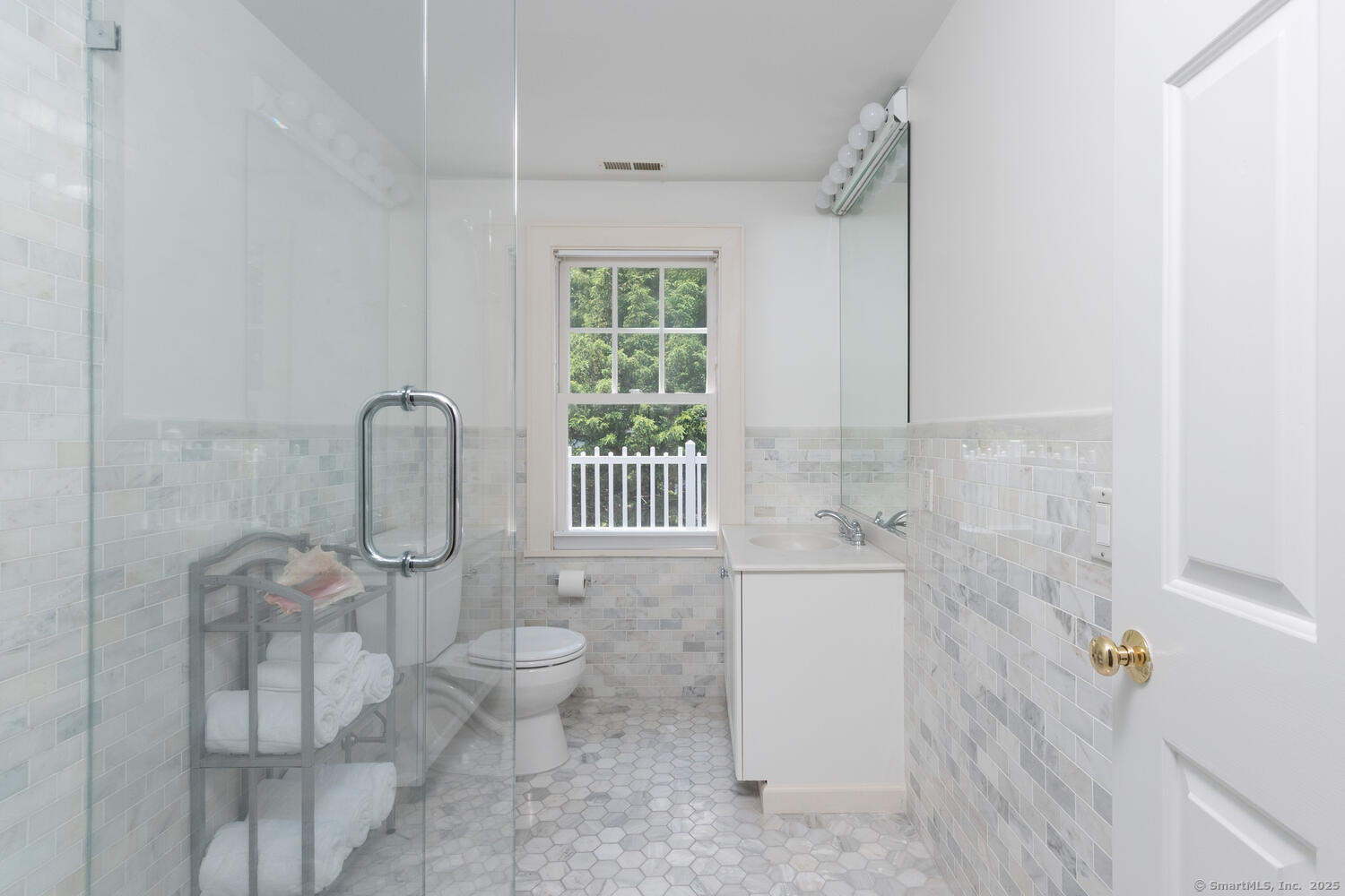 128 5 Mile River Road Darien, CT 06820 - Photo 13 of 23 a bathroom with a toilet sink and a shower