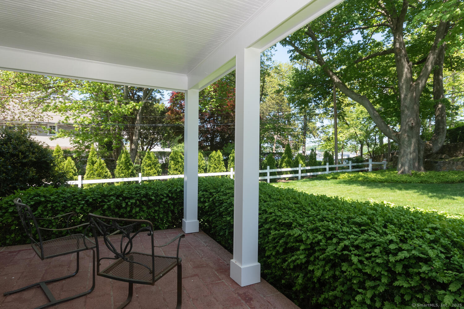 128 5 Mile River Road Darien, CT 06820 - Photo 16 of 23 a view of backyard with plants and large trees