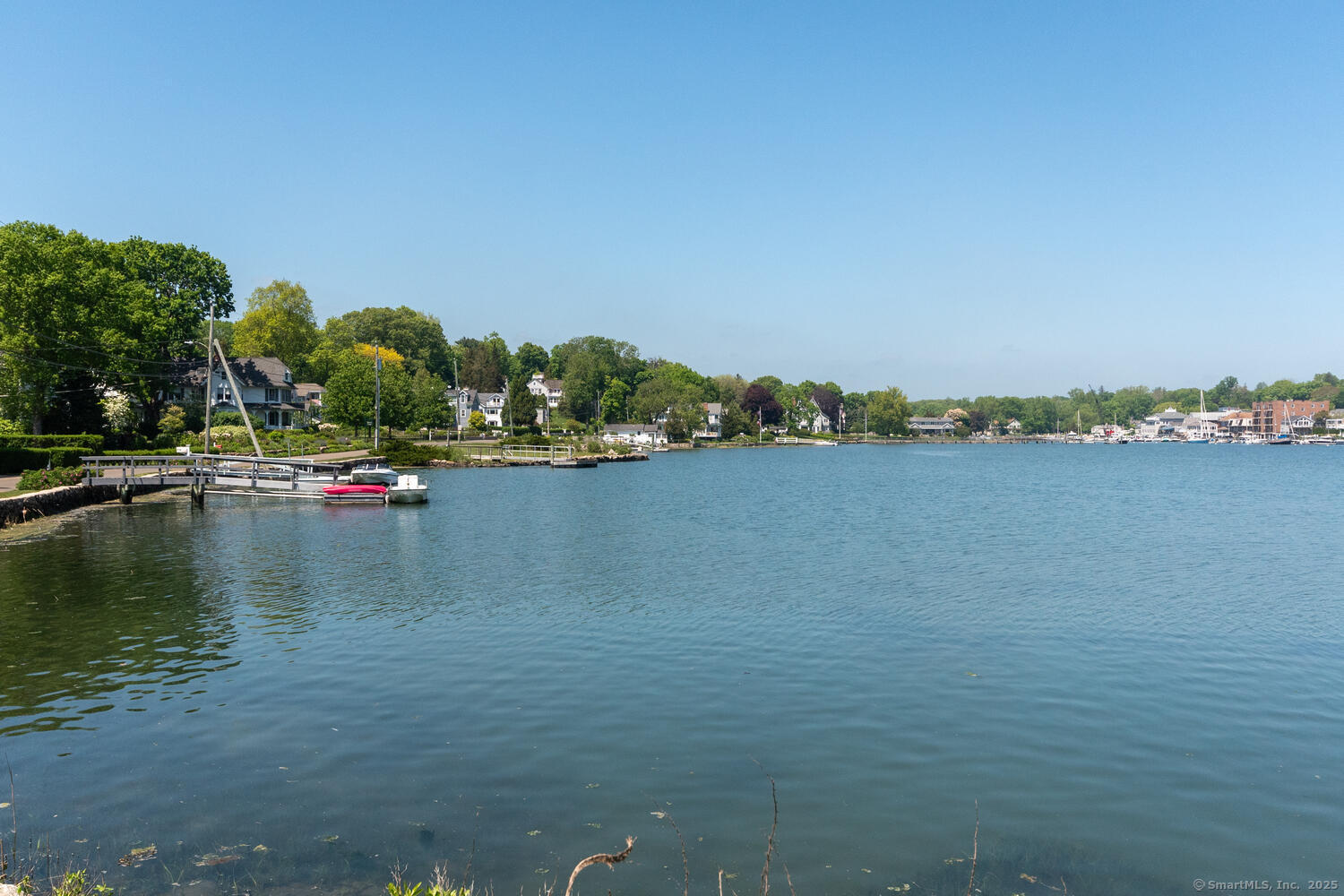 128 5 Mile River Road Darien, CT 06820 - Photo 19 of 23 a view of a lake with houses