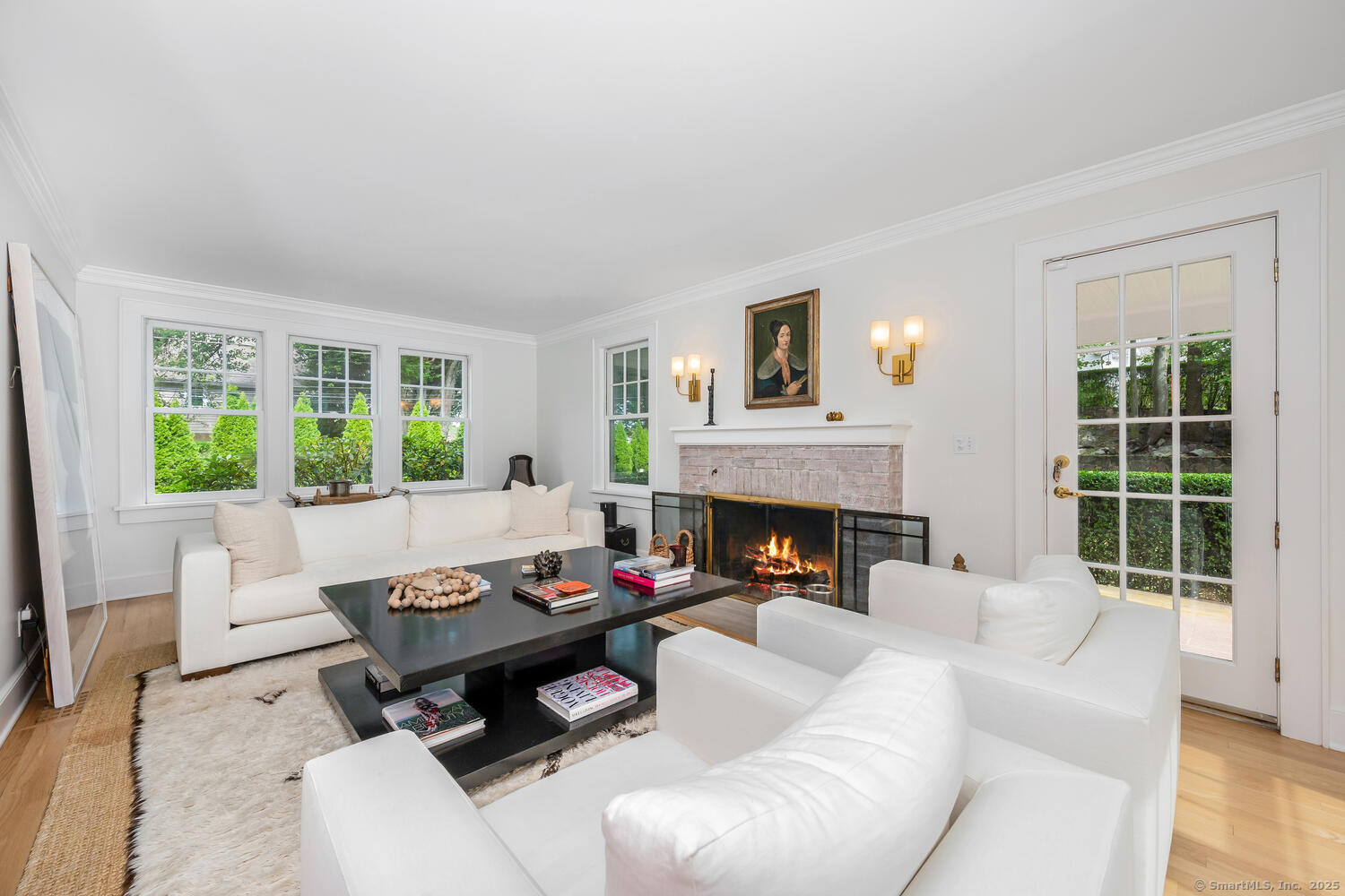 128 5 Mile River Road Darien, CT 06820 - Photo 4 of 23 a living room with furniture fireplace and a large window
