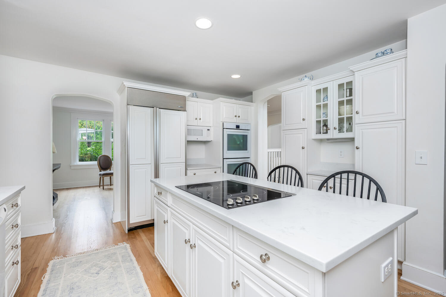 128 5 Mile River Road Darien, CT 06820 - Photo 5 of 23 a kitchen with refrigerator sink and cabinets
