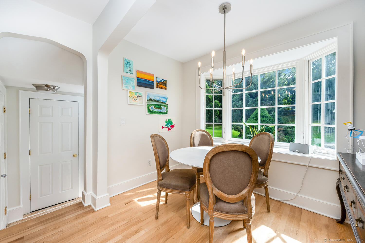 128 5 Mile River Road Darien, CT 06820 - Photo 7 of 23 a dining room with furniture a rug and wooden floor