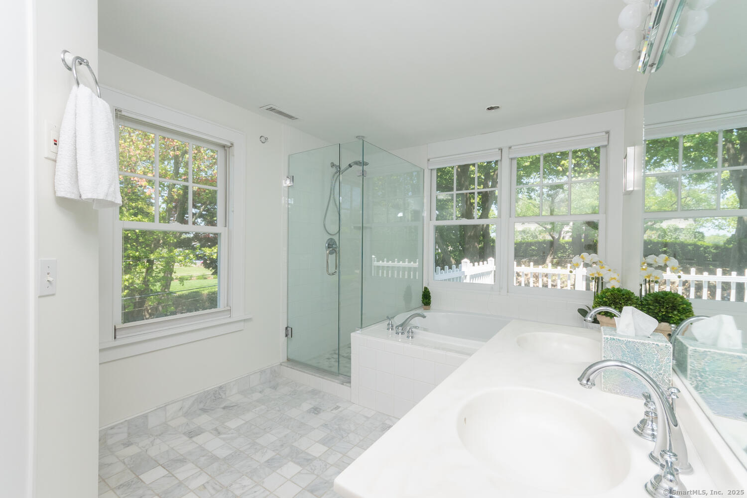 128 5 Mile River Road Darien, CT 06820 - Photo 10 of 23 a spacious bathroom with a tub and window
