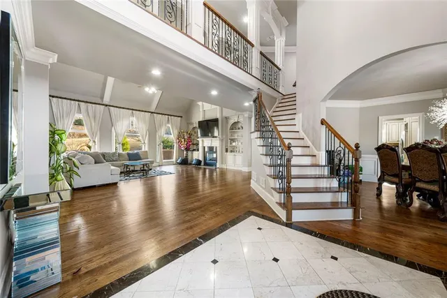 a view of a livingroom with furniture and wooden floor