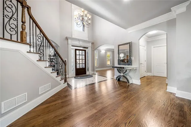 a view of an entryway with wooden floor