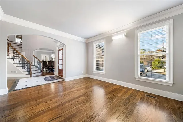 a view of a dining room with furniture and chandelier