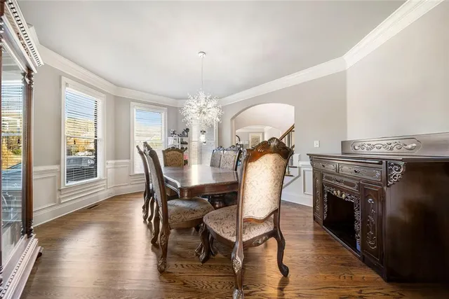 a view of a livingroom with furniture window wooden floor and windows