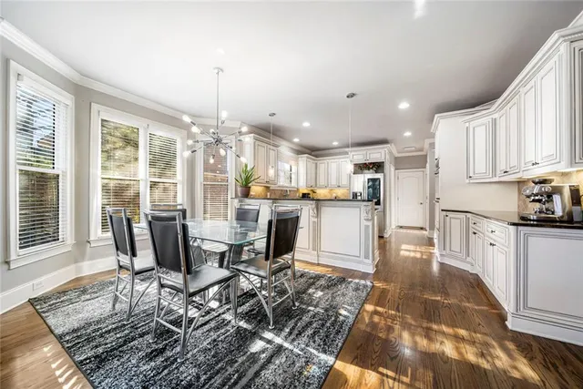 a kitchen with stainless steel appliances granite countertop a sink and cabinets
