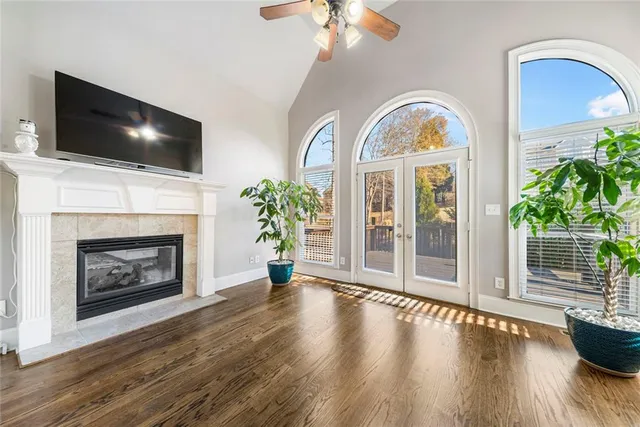 a bedroom with a bed and a ceiling fan